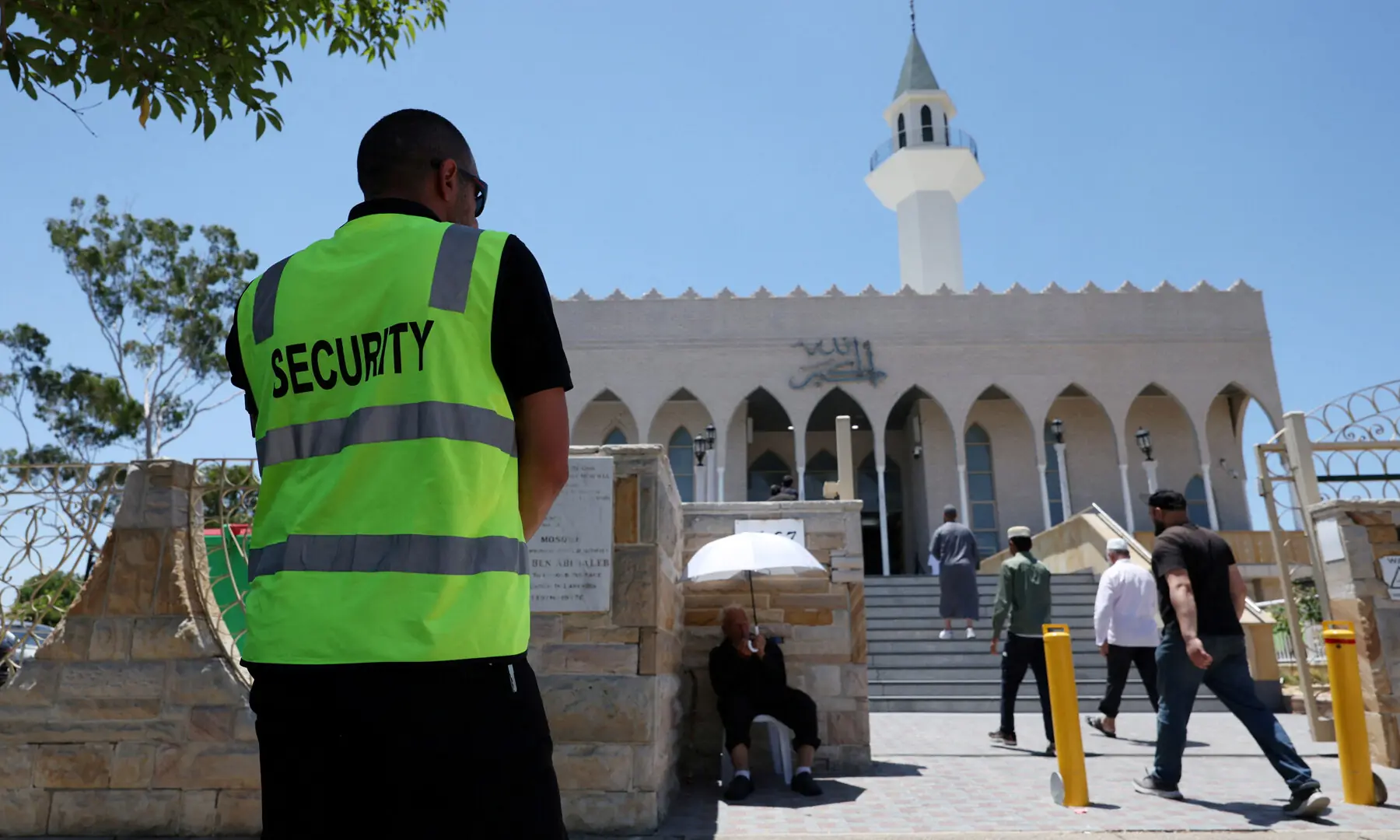 A security guard stands outside the Lakemba Imam Ali bin Abi Talib Mosque as people arrive for Friday prayers, amid a heightened security presence following the deadly mass shooting during a Jewish Hanukkah celebration at Bondi Beach on December 14, in Sydney, Australia, on December 19, 2025. &mdash; Reuters/ File