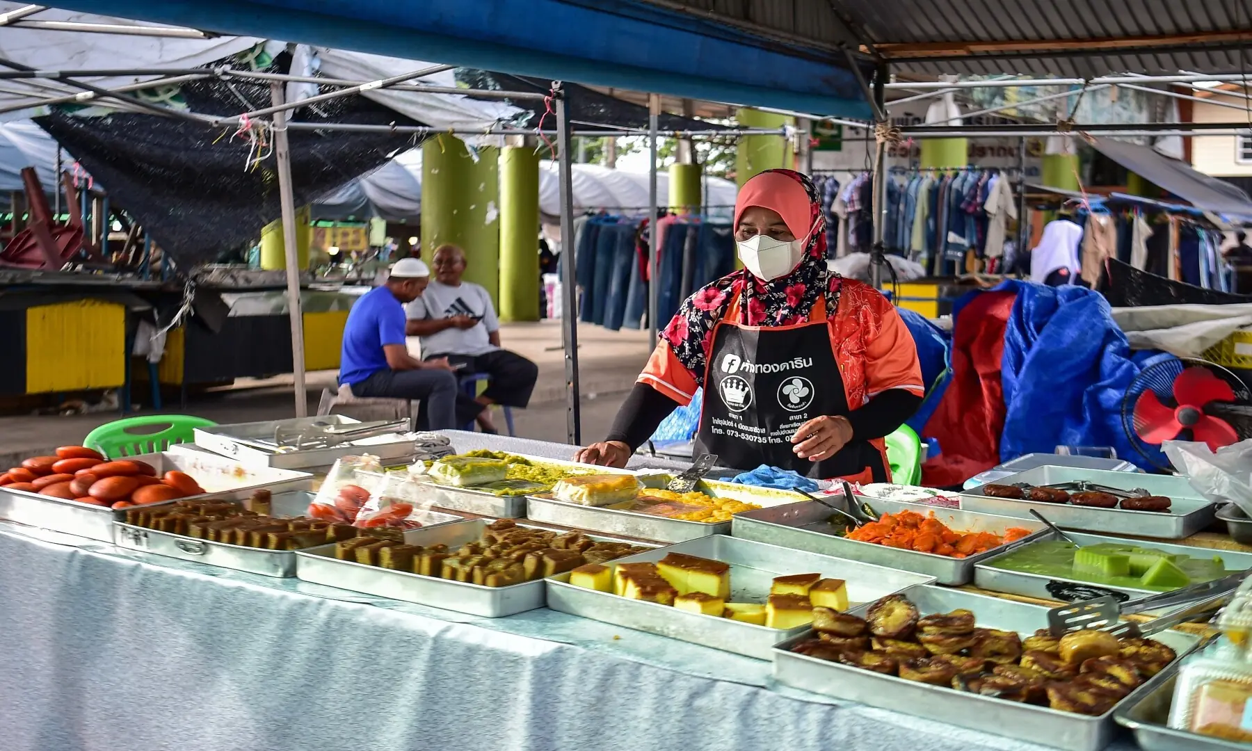 A street food vendor selling iftar meals set up a stall on the first day of Ramazan at a market in the southern Thai province of Narathiwat on February 19, 2026. &mdash; Madaree Tohlala/ AFP