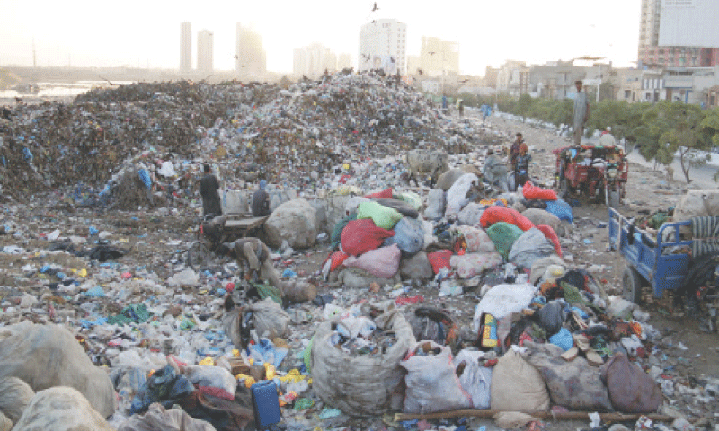 The Garbage Transfer Station-Imtiaz is set up along the Malir riverbank near Qayyumabad.—Shakil Adil / White Star The Garbage Transfer Station-Imtiaz is set up along the Malir riverbank near Qayyumabad.—Shakil Adil / White Star