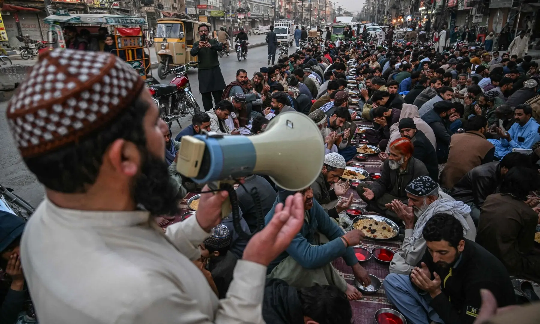 Muslim devotees pray before breaking their fast on the first day of the Islamic holy month of Ramazan in Rawalpindi on February 19, 2026. &mdash;AFP