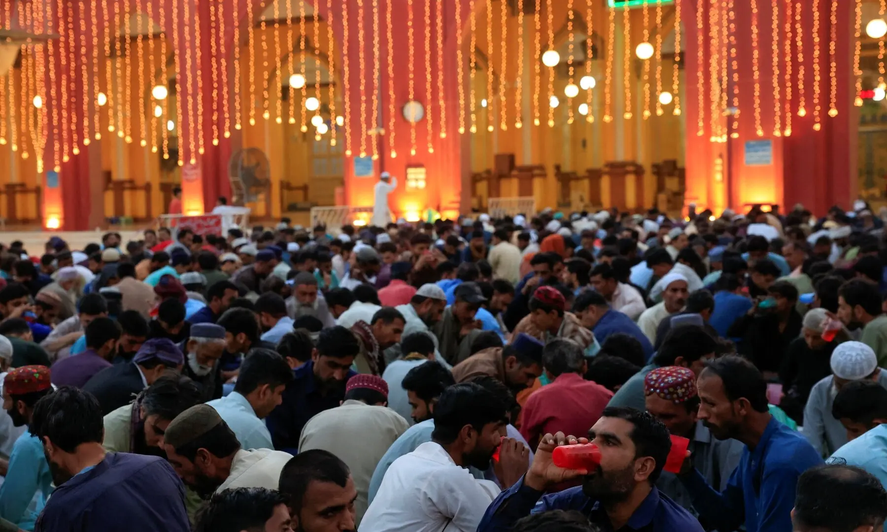 People gather to break their fast during the holy month of Ramazan at New Memon Mosque in Karachi, Pakistan, February 19, 2026. &mdash;Reuters