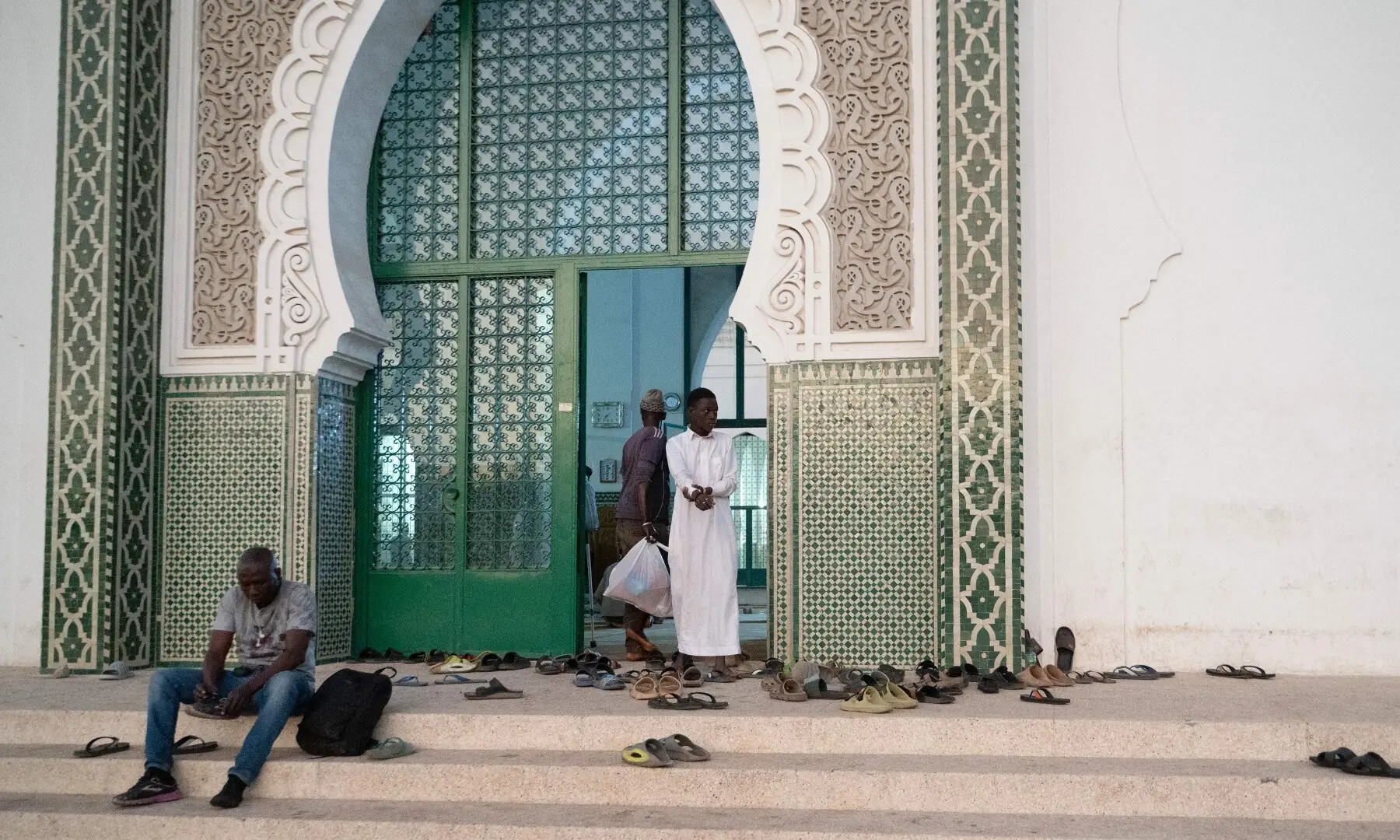 Muslim worshippers leave the Grand Mosque after breaking their fast in Dakar, on February 19, 2026, during the Muslim holy fasting month of Ramadan. Muslims throughout the world are marking the month of Ramazan, the holiest month in the Islamic calendar, during which devotees fast from dawn until dusk. &mdash;AFP