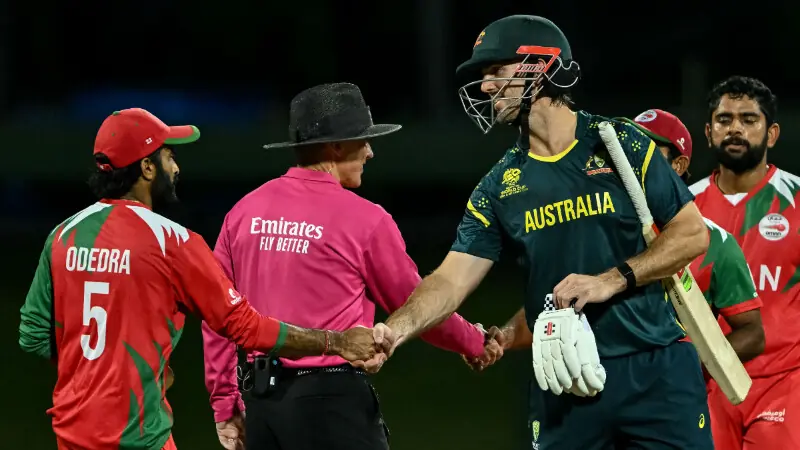 Australia&rsquo;s captain Mitchell Marsh (centre R) shakes hands with Oman&rsquo;s players at the end of the 2026 ICC Men&rsquo;s T20 Cricket World Cup group stage match between Oman and Australia at Pallekele International Cricket Stadium in Kandy on February 20, 2026. &mdash; AFP