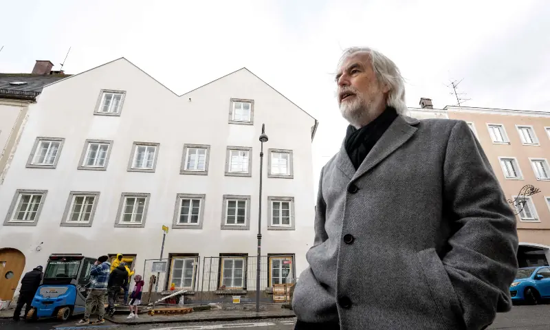 Ludwig Laher, author and member of the Mauthausen Committee Austria, gives an AFP interview in front of the birth house of former German dictator Adolf Hitler that is turned into a police station, in Braunau am Inn, Austria, on February 17, 2026. &mdash; AFP
