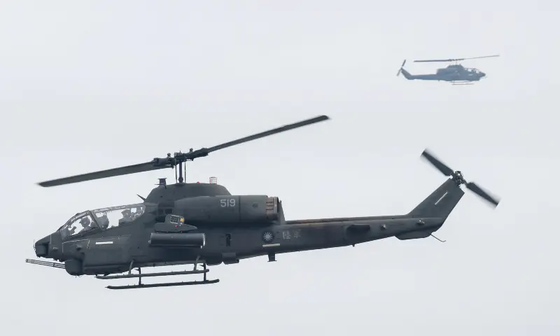 An AH-1 SuperCobra flies during an annual military exercise ahead of Lunar New Year in Taichung, Taiwan on January 27, 2026. &mdash; Reuters