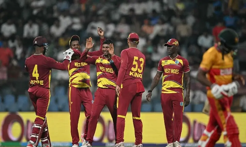 West Indies&rsquo; Gudakesh Motie (C) celebrates after taking the wicket of Zimbabwe&rsquo;s Tashinga Musekiwa during the 2026 ICC Men&rsquo;s T20 Cricket World Cup Super Eights match between West Indies and Zimbabwe at the Wankhede Stadium in Mumbai on February 23, 2026. &mdash;AFP