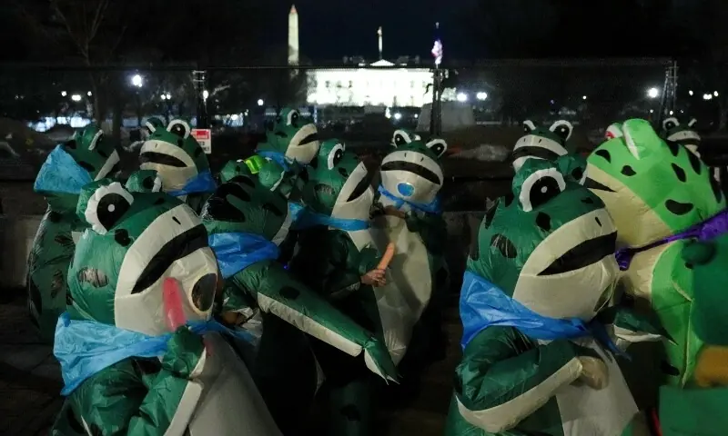 People wearing inflatable frog costumes gather near the White House following the &ldquo;State of the Swamp,&rdquo; a Democratic-led counter-programming event, and President Donald Trump&rsquo;s State of the Union address in Washington, DC., US February 25, 2026. &mdash;Reuters