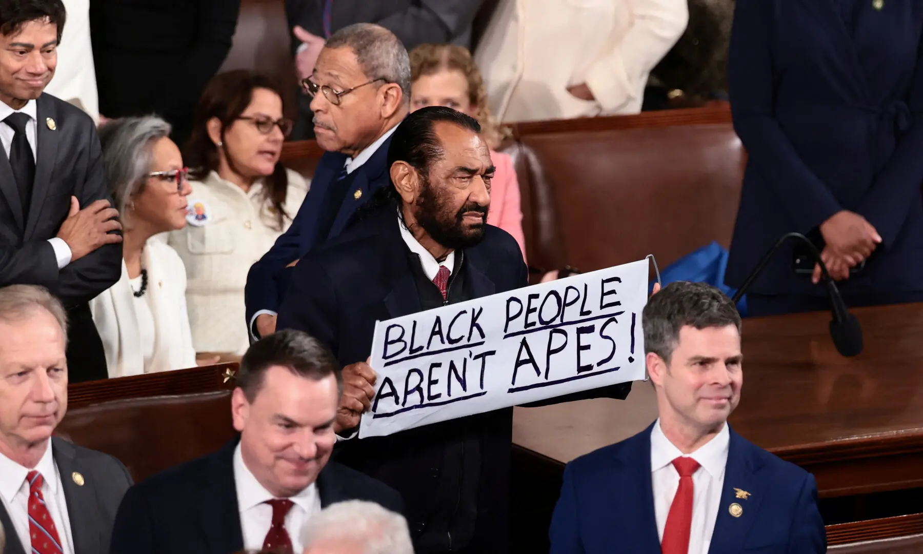Rep. Al Green (D-TX) holds a sign after US President Donald Trump arrived to deliver the State of the Union address to a joint session of Congress at the US Capitol in Washington, DC on Feb 24, 2026. &mdash; Reuters