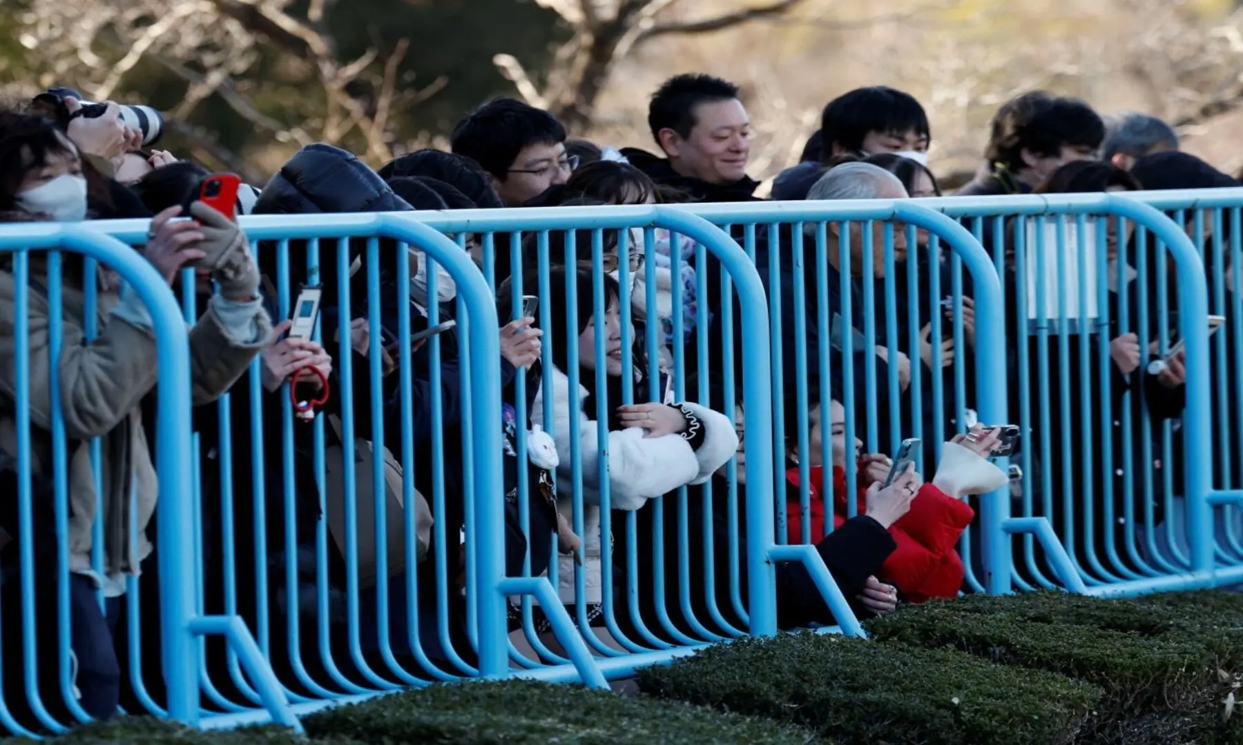 Visitors watch a baby Japanese macaque named Punch at Ichikawa City Zoo, in Ichikawa, Chiba Prefecture, Japan, February 19, 2026. — Reuters/Kim Kyung-Hoon
