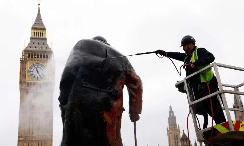 Graffiti on a statue of Britain’s former Prime Minister Winston Churchill is removed by a worker in Parliament Square, in central London on February 27, 2026. — AFP Graffiti on a statue of Britain’s former Prime Minister Winston Churchill is removed by a worker in Parliament Square, in central London on February 27, 2026. — AFP
