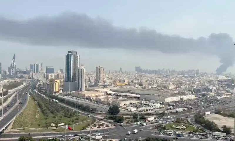 Smoke rises after the state news agency reported missile attack on the service center of the US Fifth Fleet, following strikes by the United States and Israel against Iran, in Manama, Bahrain on February 28, 2026. &mdash; Reuters