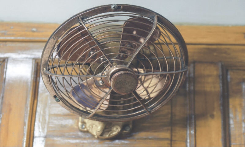 Old fan installed in coach telling the century old tradition as the coach is now air condition.