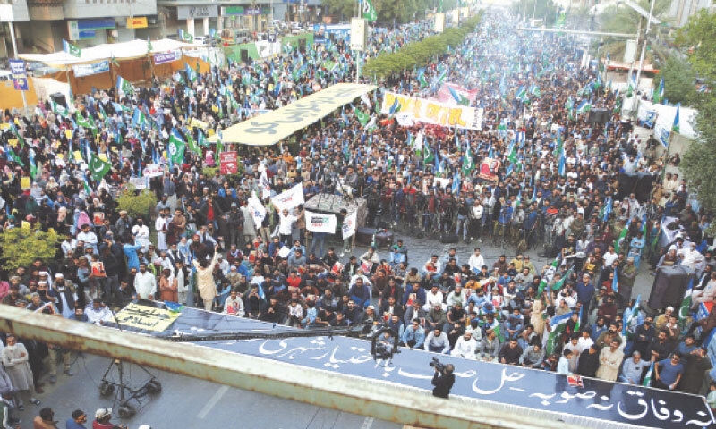A large number of workers and supporters of the JI throng Sharea Faisal to participate in the &lsquo;Let Karachi Live&rsquo; march.&mdash;Shakil Adil / White Star