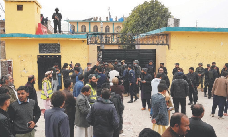 People gather outside Imambargah Qasr-i-Khadijatul Kubra in Islamabad&rsquo;s Tarlai area following a suicide blast on Friday. &mdash; Photo by Mohammad Asim