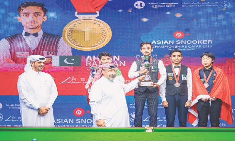 PAKISTAN&rsquo;S Ahsan Ramzan receives the Asian U-21 Snooker Championship trophy from Qatar Billiards and Snooker Federation president Mohammad Mubarak Al Ramzani after defeating Shahin Sabzi (second L) of Iran in the final, alongside bronze medallists Mohammad Hasnain Akhtar (second R) of Pakistan and Hong Kong&rsquo;s Li Langyi on Friday.&mdash;Courtesy PBSA