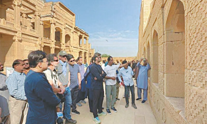 FOREIGN and local archaeologists brief participants of heritage walk about historical importance of monuments across Thatta district.—Dawn FOREIGN and local archaeologists brief participants of heritage walk about historical importance of monuments across Thatta district.—Dawn