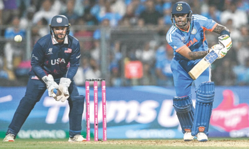 MUMBAI: Indian captain Suryakumar Yadav plays a shot as wicket-keeper Andries Gous of the US looks on during their match at the Wankhede Stadium on Saturday.&mdash;AFP