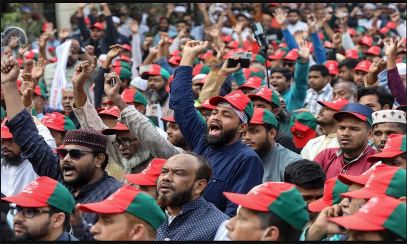 Bangladesh's Jamaat-i-Islami supporters shout slogans during a campaign rally in Mirpur on January 22, 2026 | AFP