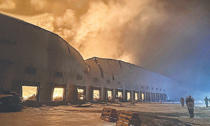 FIREFIGHTERS work at the site of a Russian drone and missile strike in Kyiv.&mdash;Reuters