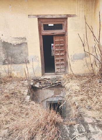 A roof has developed holes due to lack of upkeep.