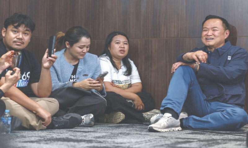 Bangkok: Bhumjaithai Party leader Anutin Charnvirakul sits on the floor ahead of a press conference at the party headquarters on Sunday.&mdash;Reutres