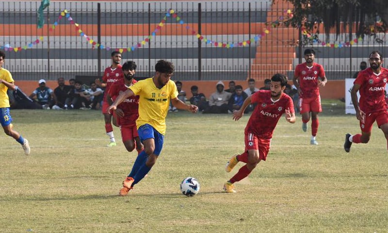 KARACHI: Players of Army and International Supply Company vie for the ball during their National Challenge Cup Group &lsquo;C&rsquo; match at the KPT Stadium on Sunday.&mdash;Courtesy PFF