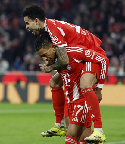 MUNICH: Luis Diaz (above) of Bayern Munich celebrates with team-mate Michael Olise after scoring against Hoffenheim during their Bundesliga match at the Allianz Arena on Sunday.&mdash;AFP