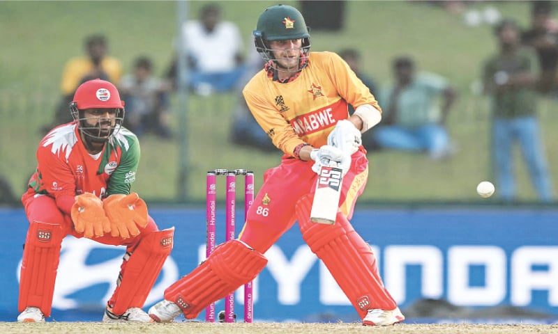 COLOMBO: Zimbabwe opener Brian Bennett eyes a stroke as Oman wicket-keeper Vinayak Shukla looks on during their Group ‘B’ match at the Sinhalese Sports Club Ground on Monday.—AFP COLOMBO: Zimbabwe opener Brian Bennett eyes a stroke as Oman wicket-keeper Vinayak Shukla looks on during their Group ‘B’ match at the Sinhalese Sports Club Ground on Monday.—AFP