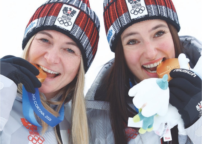 BELLUNO: Austria&rsquo;s Ariane Raedler (L) and Katharina Huber pose with their gold medals after winning the Alpine Skiing women&rsquo;s team combined final at the Tofane Alpine Skiing Centre on Tuesday.&mdash;Reuters