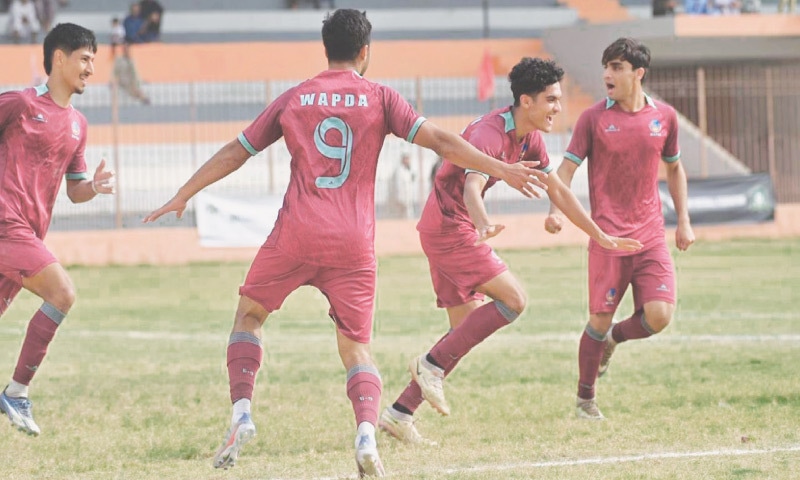 PLAYERS of Wapda celebrate after scoring against the PAF during their National Challenge Cup quarter-final at the KPT Stadium on Tuesday.—Courtesy PFF PLAYERS of Wapda celebrate after scoring against the PAF during their National Challenge Cup quarter-final at the KPT Stadium on Tuesday.—Courtesy PFF