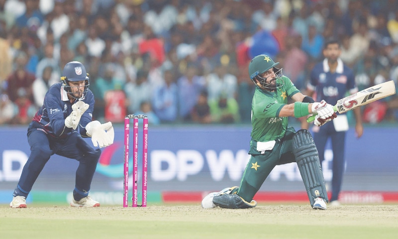 COLOMBO: Pakistan opener Sahibzada Farhan plays a shot as USA wicket-keeper Andries Gous looks on during their group stage match at the Sinhalese Sports Club Ground on Tuesday.—Courtesy PCB COLOMBO: Pakistan opener Sahibzada Farhan plays a shot as USA wicket-keeper Andries Gous looks on during their group stage match at the Sinhalese Sports Club Ground on Tuesday.—Courtesy PCB