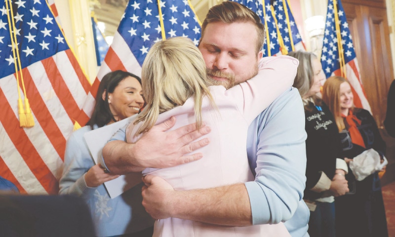 Epstein abuse survivor Danielle Bensky hugs Sky Roberts, brother of Virginia Giuffre, after Democrats introduced ‘Virginia’s Law’.—AFP Epstein abuse survivor Danielle Bensky hugs Sky Roberts, brother of Virginia Giuffre, after Democrats introduced ‘Virginia’s Law’.—AFP