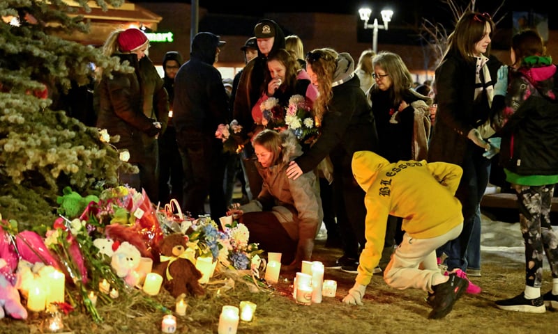 Mourners lay flowers during a vigil, a day after the deadly mass shooting in Tumbler Ridge.&mdash;Reuters