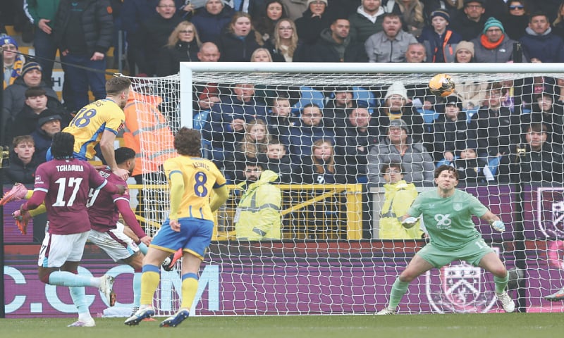 BURNLEY: Mansfield Town&rsquo;s Rhys Oates (top) heads to score past Burnley goalkeeper Max Weiss during their FA Cup fourth-round match at Turf Moor on Saturday.&mdash;Reuters