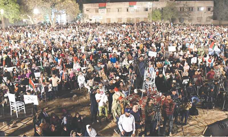 Muttahida workers listen to the speeches of party leaders at the public meeting in Liaquatabad.&mdash;Dawn