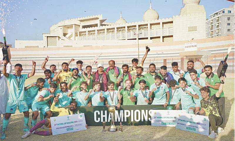WAPDA players celebrate with the National Challenge Cup trophy after defeating Khan Research Laboratories in the final at the KPT Stadium on Sunday.&mdash;Courtesy PFF