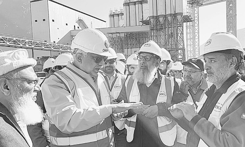 WAPDA Chairman retired Lt Gen Muhammad Saeed interacts with officials during a site visit.&mdash;Dawn