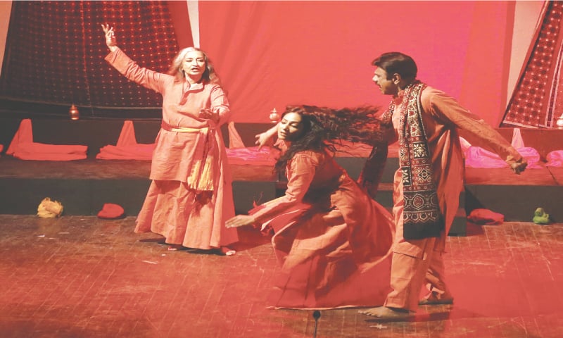 A scene from the play in which the main character (Sheema Kermani) envisions her younger self (Naina Black, centre) being stopped by her father (Imran Khan) from dancing.&mdash;Shakil Adil / White Star