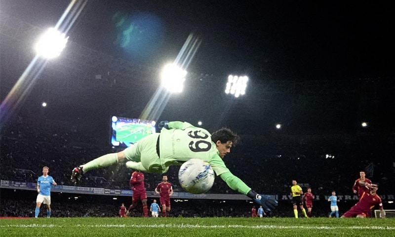 NAPLES: Alisson Santos of Napoli scores past AS Roma goalkeeper Mile Svilar during their Serie A match at Stadio Diego Armando Maradona.&mdash;Reuters