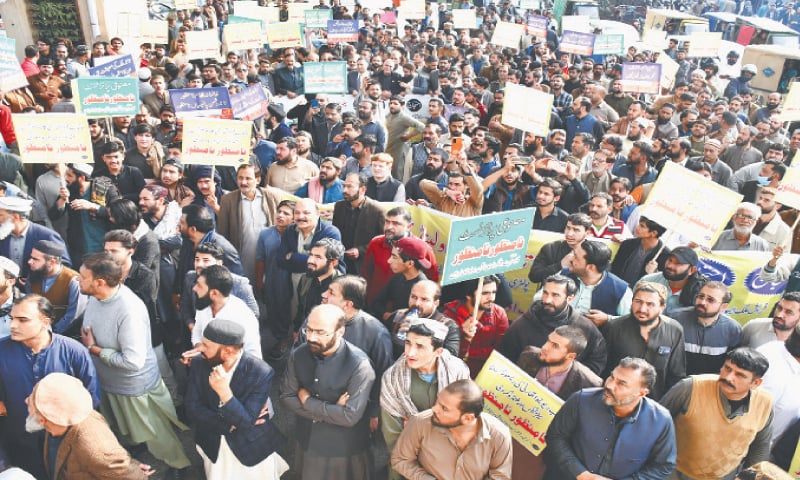 Traders stage a protest on Murree Road in Rawalpindi on Tuesday. — Photo by Mohammad Asim Traders stage a protest on Murree Road in Rawalpindi on Tuesday. — Photo by Mohammad Asim