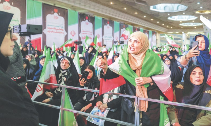 A woman draped in the Iranian flag speaks during a ceremony marking the 40th day of mourning for demonstrators who died during anti-government protests.—AFP A woman draped in the Iranian flag speaks during a ceremony marking the 40th day of mourning for demonstrators who died during anti-government protests.—AFP