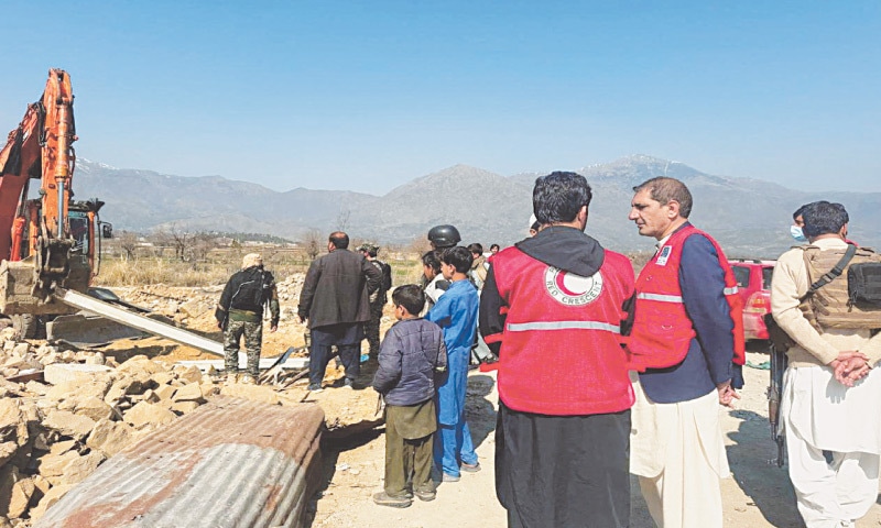 RESCUERS and emergency workers are seen on the scene after a terrorist attack in Bajaur claimed the lives of a dozen people, including 11 security personnel.&mdash;Reuters