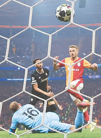  ISTANBUL: Galatasaray&rsquo;s Noa Lang (R) scores past Juventus goalkeeper Michele Di Gregorio during their Champions League playoff first-leg at Rams Park.&mdash;Reuters 
