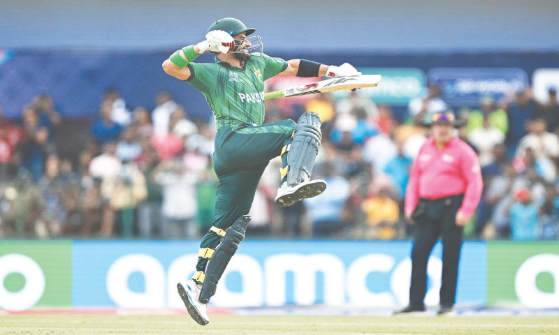 COLOMBO: Sahibzada Farhan punches the air as he celebrates his century during Pakistan&rsquo;s T20 World Cup group match against Namibia. Victory over the Namibians propelled Pakistan into the Super Eight stage of the tournament, where they will first face New Zealand on Saturday.&mdash;AFP