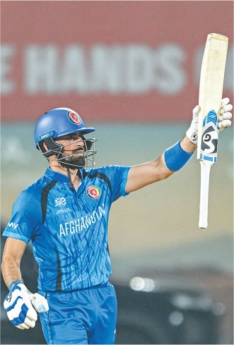 Afghanistan opener Ibrahim Zadran celebrates after scoring the half-century during the group stage match against Canada at the M.A. Chidambaram Stadium on Thursday.—AFP