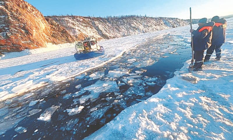 Rescuers at the scene after the bus carrying Chinese tourists plunged into the ice-covered waters of Siberia&rsquo;s Lake Baikal.&mdash;Reuters