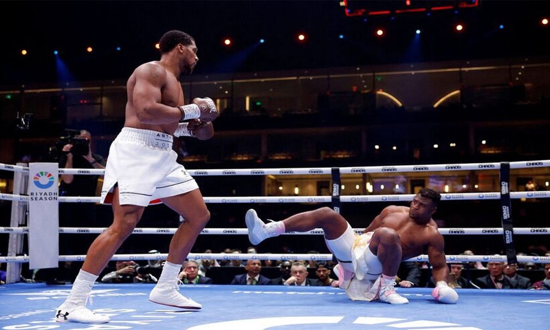 Anthony Joshua of Britain knocks down Francis Ngannou of France during a bout at the Kingdom Arena, Riyadh, Saudi Arabia on March 9, 2024: knock-outs can shorten a boxer&rsquo;s life | Reuters