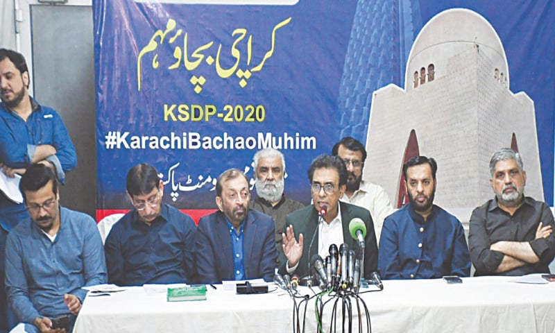 FLANKED by Faisal Subzwari, Aminul Haque, Dr Farooq Sattar, Syed Mustafa Kamal and Anis Kaimkhani, 
Dr Khalid Maqbool Siddiqui speaks at the press conference.&mdash;White Star