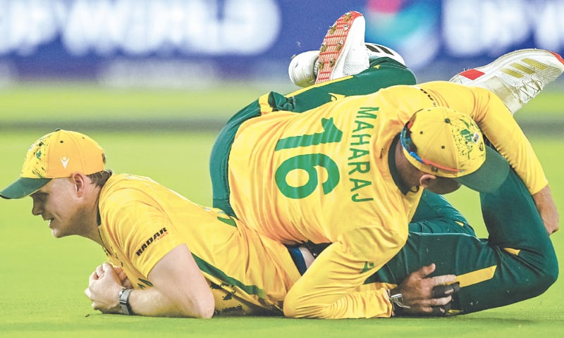 SOUTH AFRICA’S Corbin Bosch (L) collides with team-mate Keshav Maharaj after taking a catch to dismiss Indian opener Abhishek Sharma during their Super Eights match at the Narendra Modi Stadium on Sunday.—AFP SOUTH AFRICA’S Corbin Bosch (L) collides with team-mate Keshav Maharaj after taking a catch to dismiss Indian opener Abhishek Sharma during their Super Eights match at the Narendra Modi Stadium on Sunday.—AFP