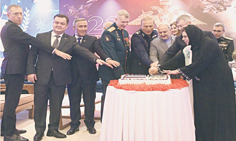 Ambassador Extraordinary and Plenipotentiary of the Russian Federation Albert P Khorev, Defence Attache Colonel Vadim N Fenchenko, chief guest Air Marshal Shakeel Gazanfar and other dignitaries cut a cake on the occasion of the Defender of the Fatherland Day in Islamabad on Monday. &mdash; White Star